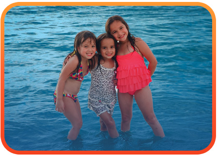 Kids enjoying the ocean in Negril, Jamaica